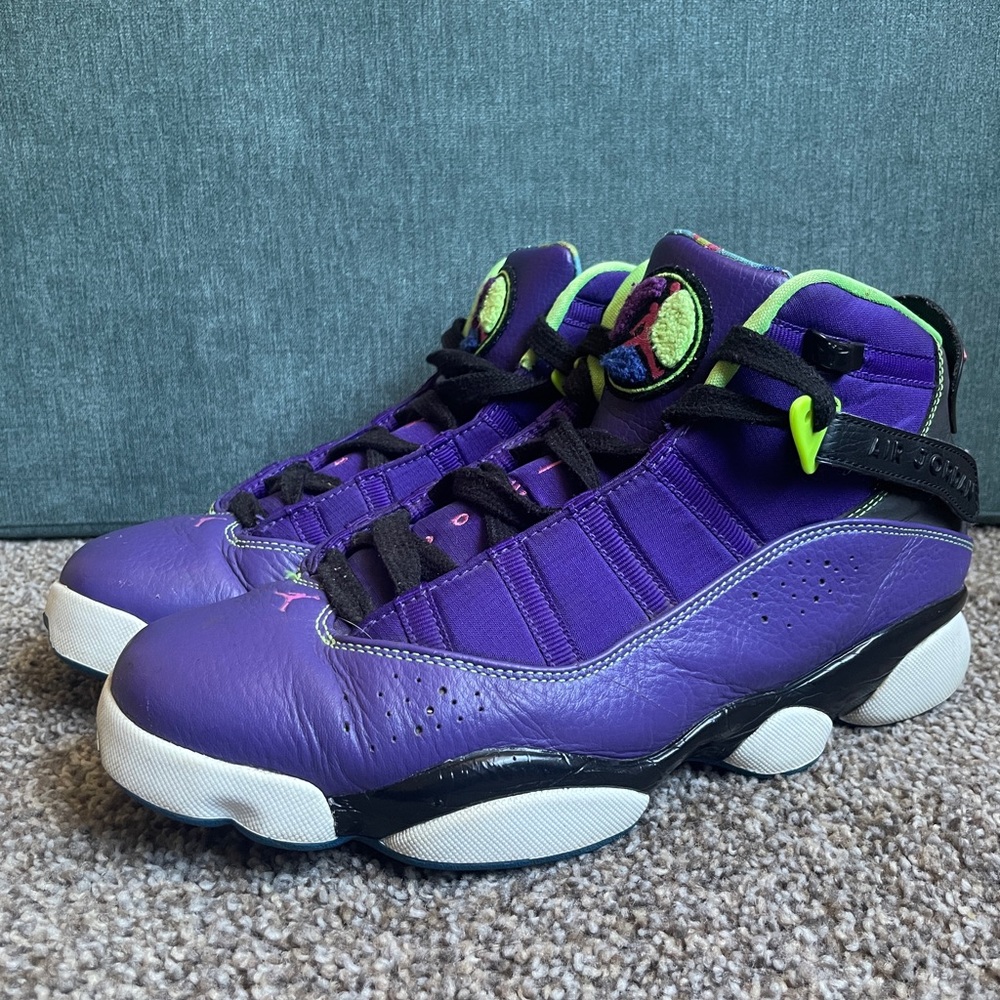 Purple and black “Bel Air” Jordans with neon accents, size 9.5